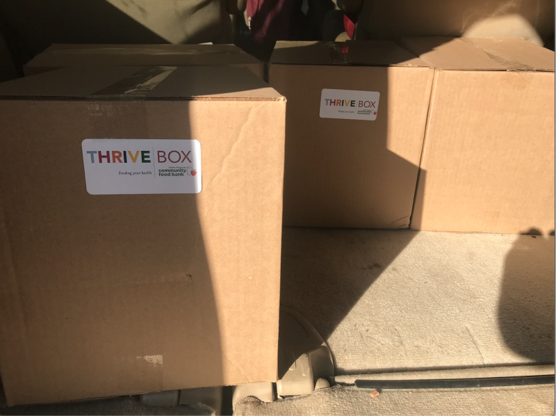 Two cardboard boxes labelled THRIVE