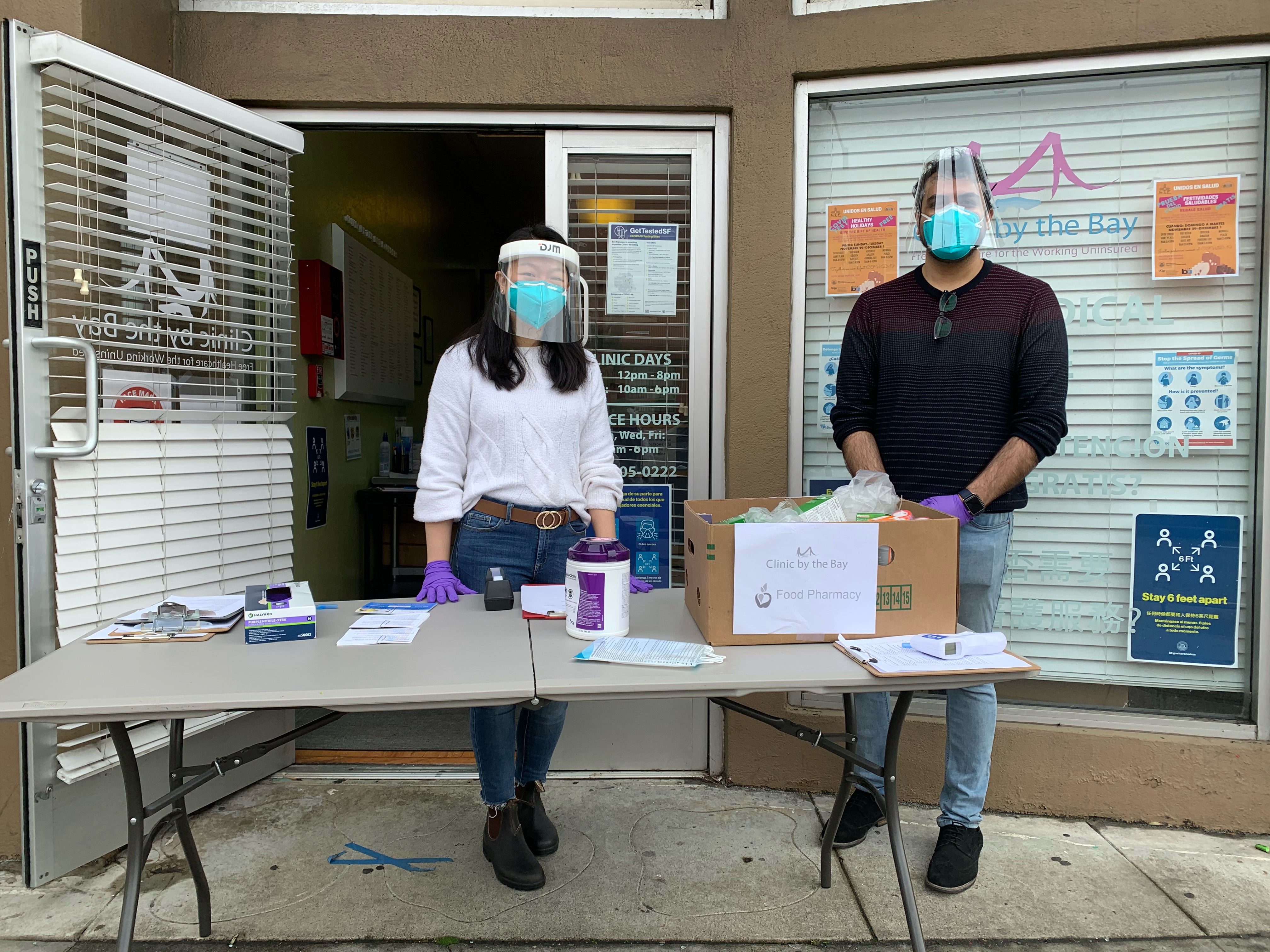 Cindy Won (left), serving at Clinic by the Bay's Food Pharmacy.