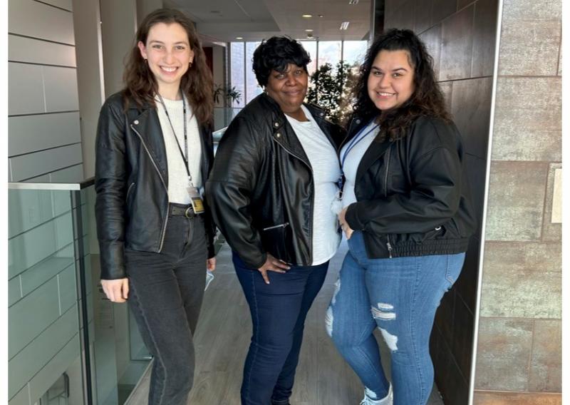 a photo of three people wearing matching leather jackets