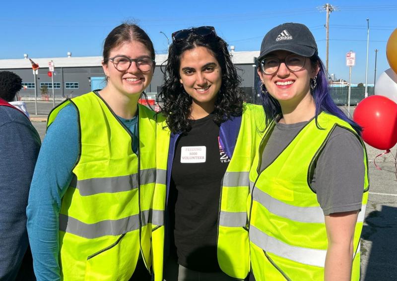 Alya is standing in the middle of the frame facing the camera. To the left is AmeriCorps member Emily Whalen and to the right is AmeriCorps member Megan Armstrong. 