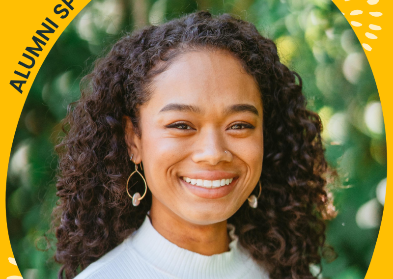 The image is an edited Canva image title Alumni Spotlight. In the middle is a headshot of Whitney Francis smiling at the camera. Below is a caption stating "Whitney Francis, NHC SF 2019-2020". 