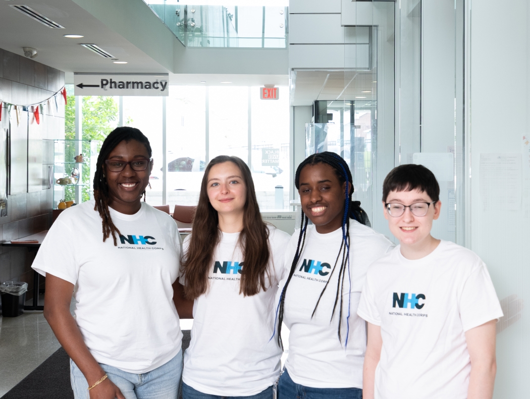 Four members where NHC T-shirt 