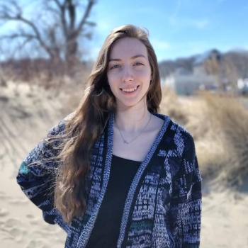 Breanna in front of tree