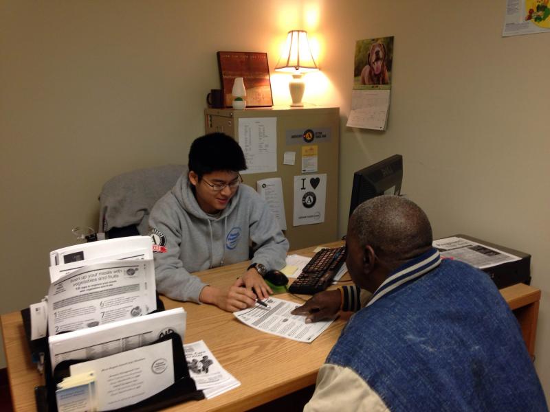 NFHC AmeriCorps member, Han, meets with a client