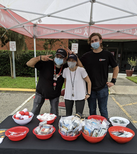 tabling outside of the CAN clinic to hand out condoms and chatting about how to protect your sexual health.