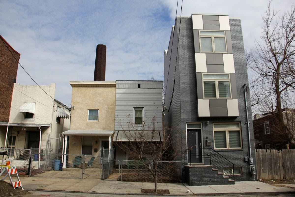 four row homes in east kensington, one of which stands out as new development increases